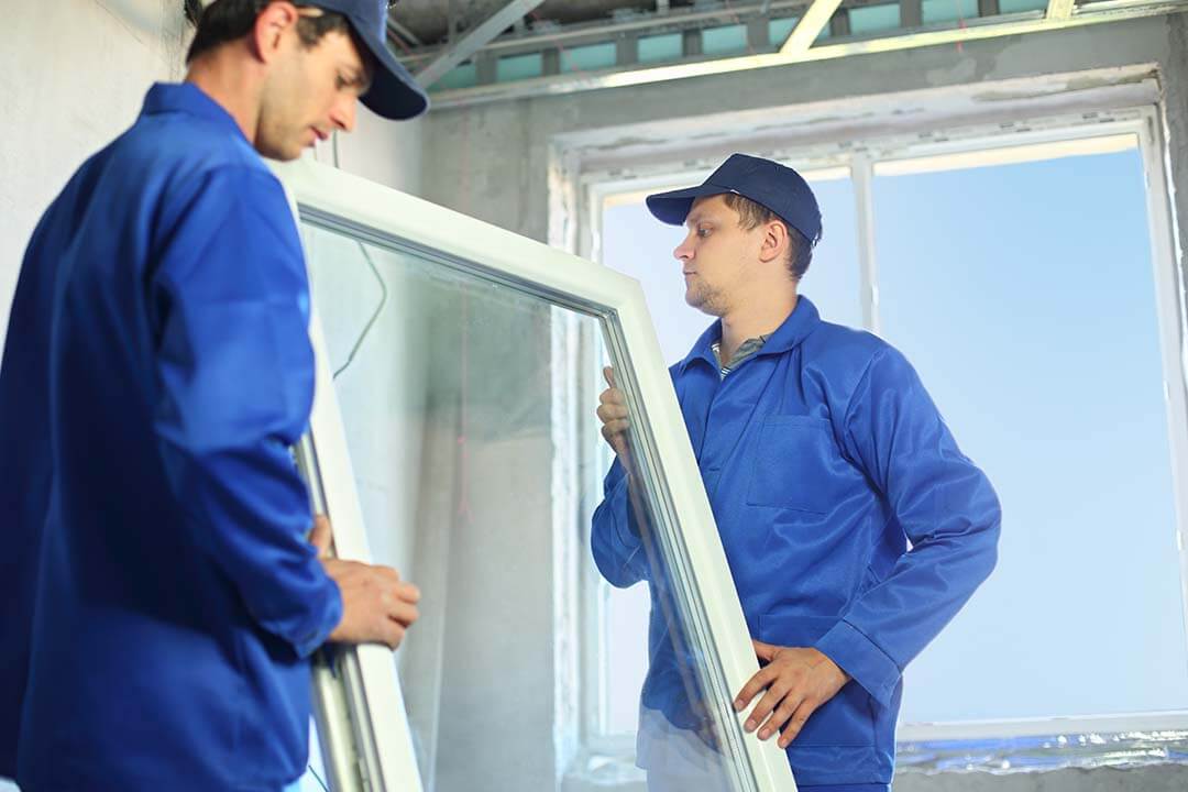 men installing replacement window in illinois