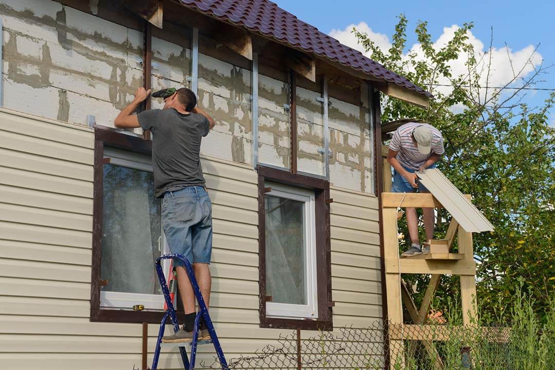 men installing new siding in home remodel in Quad City