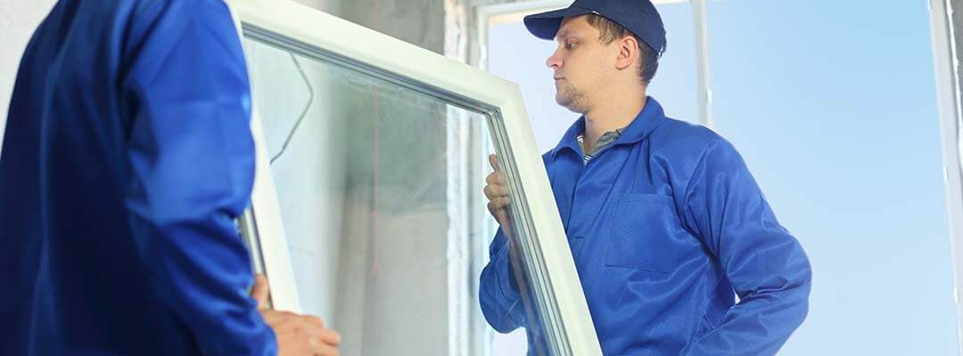 men installing replacement window in illinois