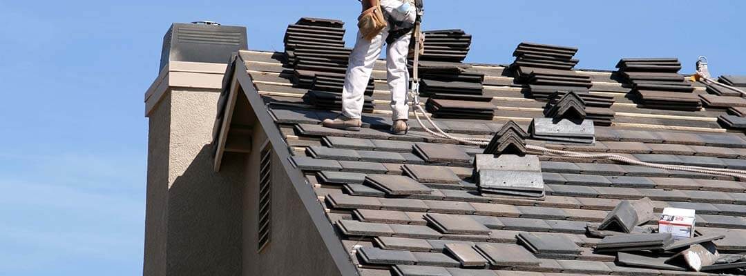 man replacing roof in home remolding in Davenport, IA