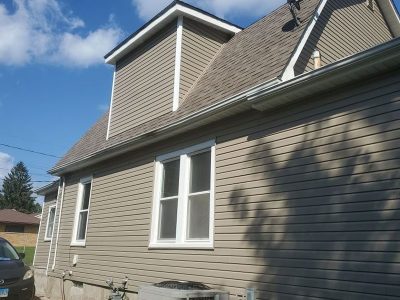 The back of a modern, two-story home in Moline, IL, to show the newly cleaned siding.