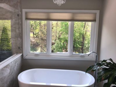 A casement window above a tub in a bathroom in a home in Davenport, IA.