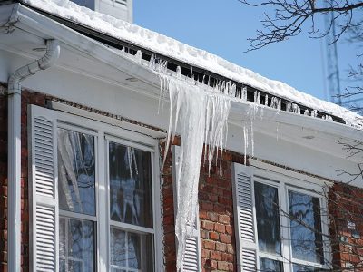 An ice dam forms and damages the gutters of a home in Bettendorf, IA.