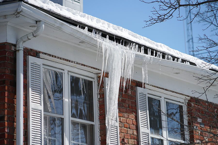 An ice dam forms and damages the gutters of a home in Bettendorf, IA.