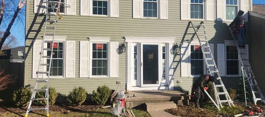 A house with new Restorations Windows being installed by Mainstream Home Improvement.