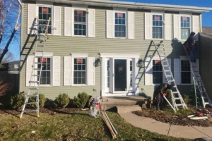 A house with new Restorations Windows being installed by Mainstream Home Improvement.
