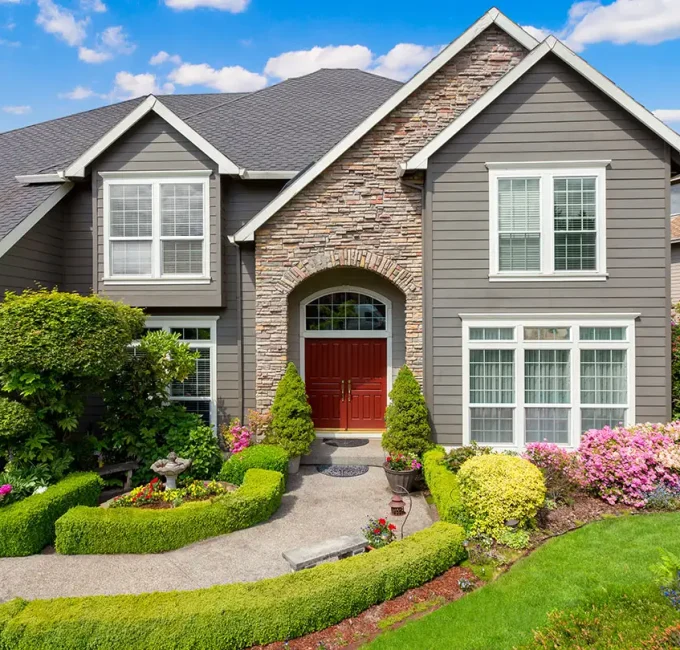 grey siding tan brick house