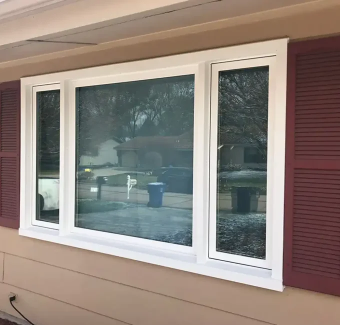 tan house maroon shutters window replacement