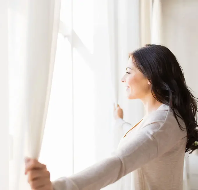 women looking out of casement window
