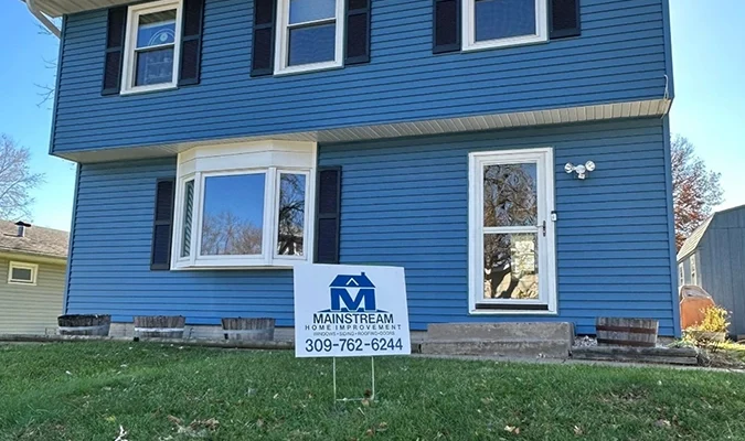 A house in Davenport, IA with new siding installed by Mainstream Home Improvement.