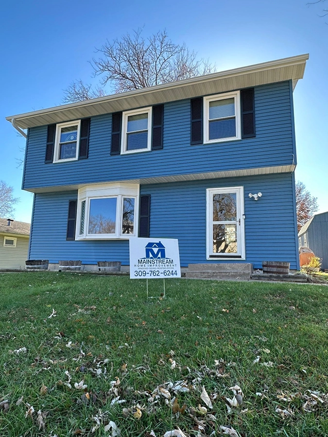 A house in Davenport, IA with new siding installed by Mainstream Home Improvement.