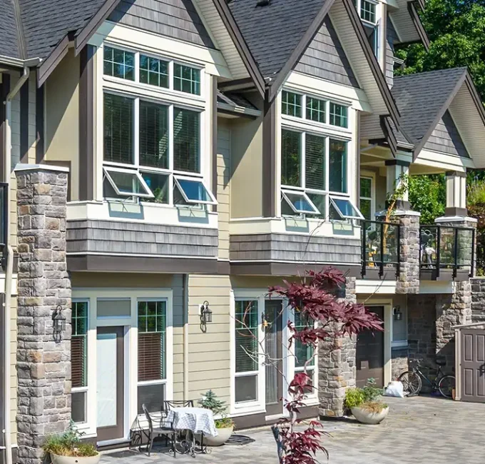 A large commercial condo building with brand new vinyl windows installed by a home improvement company in the Quad Cities area.