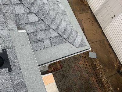 rock island gutter installation - corner roof shingles and gutter removed, during