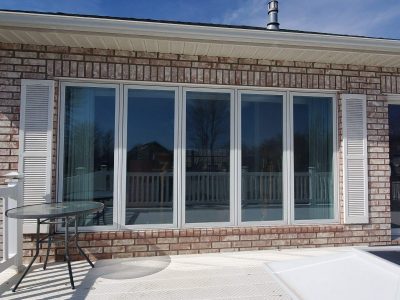 muscatine window installation - exterior set of living room windows, before