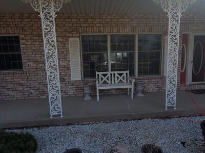 muscatine window installation - exterior front porch with windows and bench, before