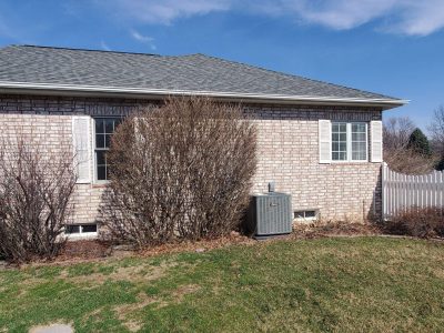 muscatine window installation - exterior side of brick house, before