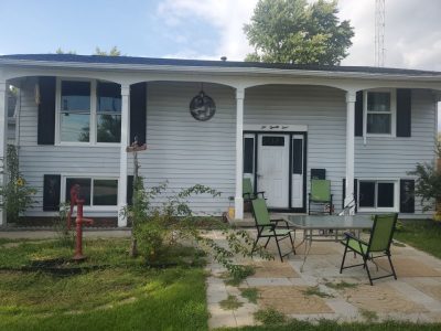 camanche window replacement - exterior front of house with new windows, after