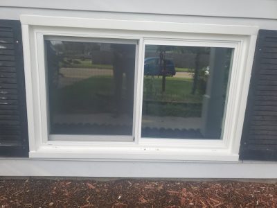 camanche window replacement - exterior new basement window, after