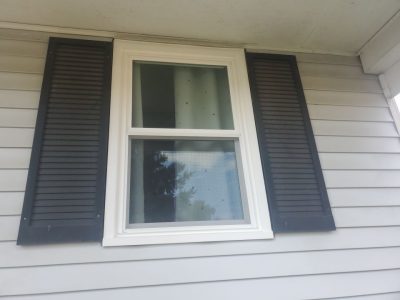 camanche window replacement - exterior living room new window, after