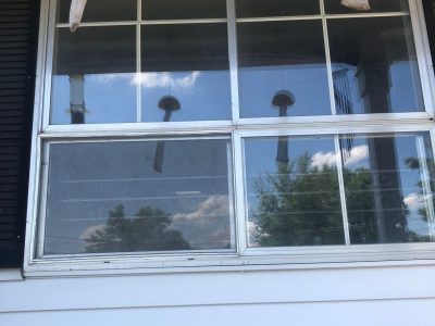 camanche window replacement - exterior living room window, before