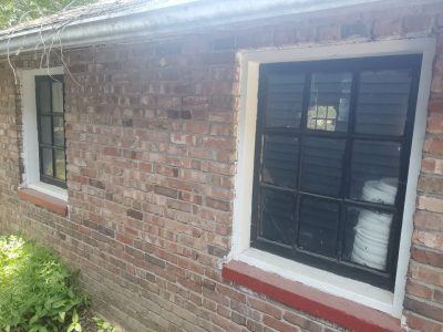 moline window replacement - exterior back of house with one old window, before