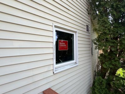 bettendorf roofing replacement - exterior of house with new single garage window, after