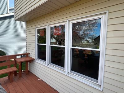 bettendorf roofing replacement - exterior of house with 3 new windows, after