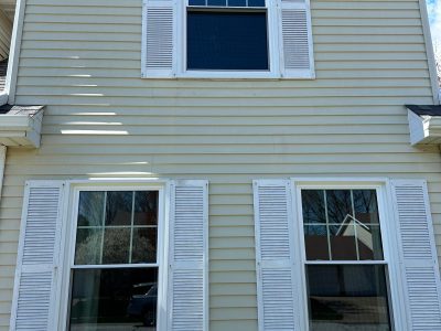 bettendorf roofing replacement - exterior of house with new upstairs & downstairs windows, after