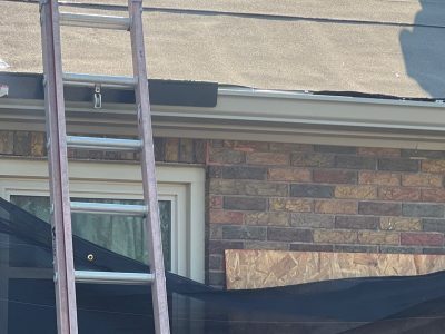 rock island roofing replacement - ladder to roof work, during