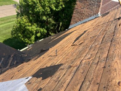 rock island roofing replacement - roof shingles being removed, during - 3