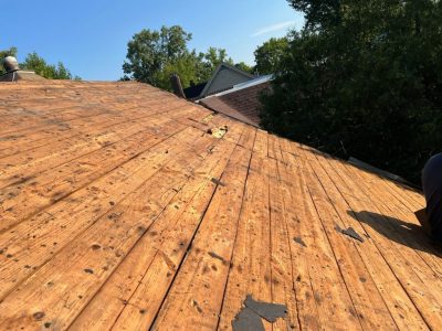 rock island roofing replacement - roof shingles being removed, during