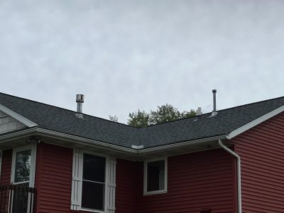 east moline roofing replacement - new gray roof on red house, after - 3