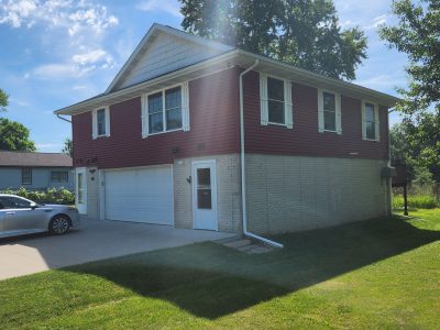 east moline roofing replacement - exterior side of two-story red house, before