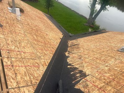east moline roofing replacement - old roof being removed, during - 2