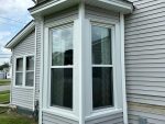 maquoketa home improvement - two new exterior windows with white trim, after