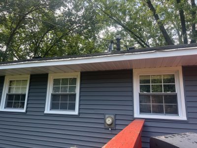 bettendorf siding replacement - back of house with deck, after