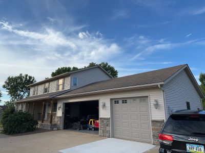davenport roofing replacement - exterior of house with garage, before - 3