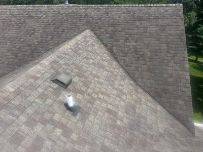 blue grass roofing installation - unique corner of old grey roof, before