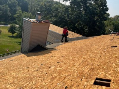 blue grass roofing installation - new roof around chimney, during