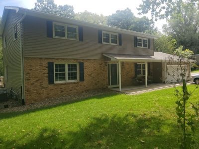 coal valley roofing installation - backyard view of old house roof, before