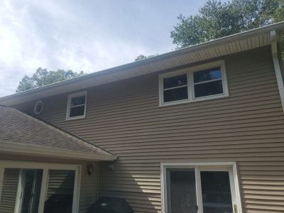 coal valley roofing installation - view of backyard and house, before