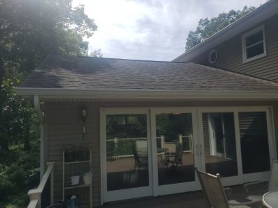 coal valley roofing installation - exterior view of glass patio doors, before