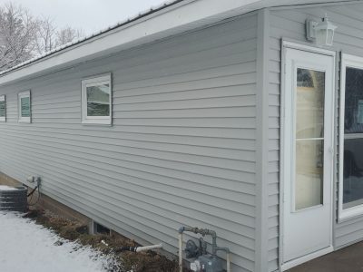 muscatine siding replacement - corner view of garage with new gray siding, after