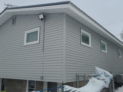 muscatine siding replacement - corner view of house with new gray siding, after