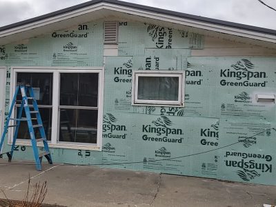 muscatine siding replacement - back of house with new siding layers, during