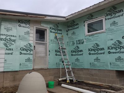 muscatine siding replacement - corner of house with new siding layers, during