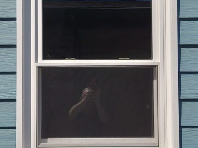 east moline window replacement - exterior close-up view of new white bathroom window, after