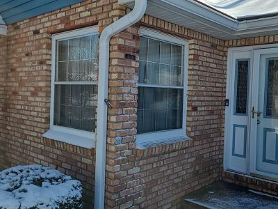 east moline window replacement - corner of house with two windows, before