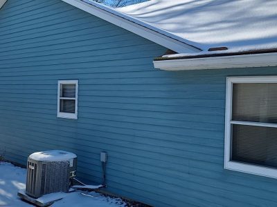 east moline window replacement - long blue side of house with two windows, before