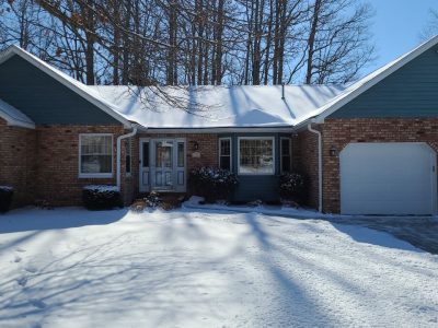 east moline window replacement - front yard view of blue and brick house, before